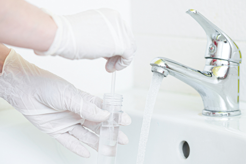 Tap,Water,Analysis,Quality,Control,Concept.,Hand,With,A,Flask